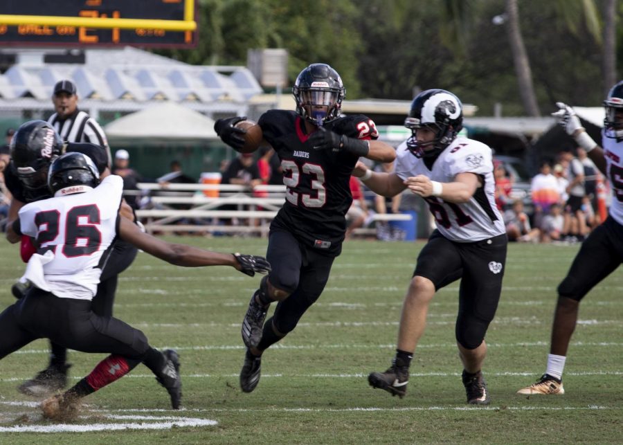 Lanakila Pei 20 returns a punt return against Radford during the Homecoming Game.