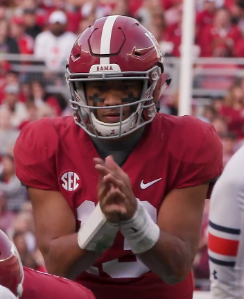 Tua Tagovailoa prepares to receive a snap.