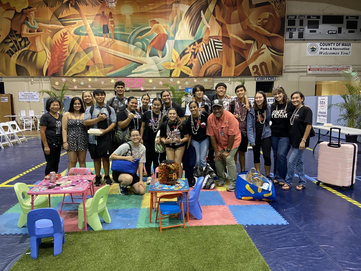 Members of ‘Iolani’s Wahine Hula, Hawaiian Ensemble and Community and Civic Engagement Staff gather for a picture following the Hispanic Resource Fair.