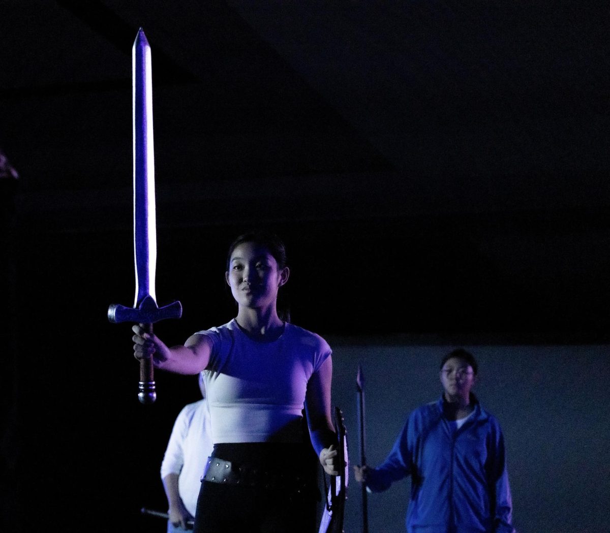 Dramatic indigos and lavenders fall upon Tilly Evans (played by Kayli Shimizu ’28) and make the Eastern Blade of Dreamwalker glow.
