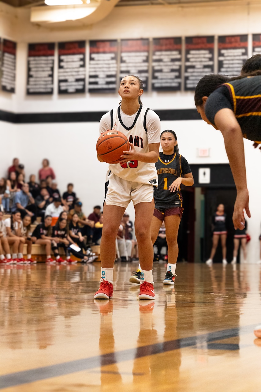 Justice Kekauoha ’25 sets up for a free throw in the ILH playoff game against Maryknoll. After fighting a long game it ended with Maryknoll winning 55-22 against Iolani.