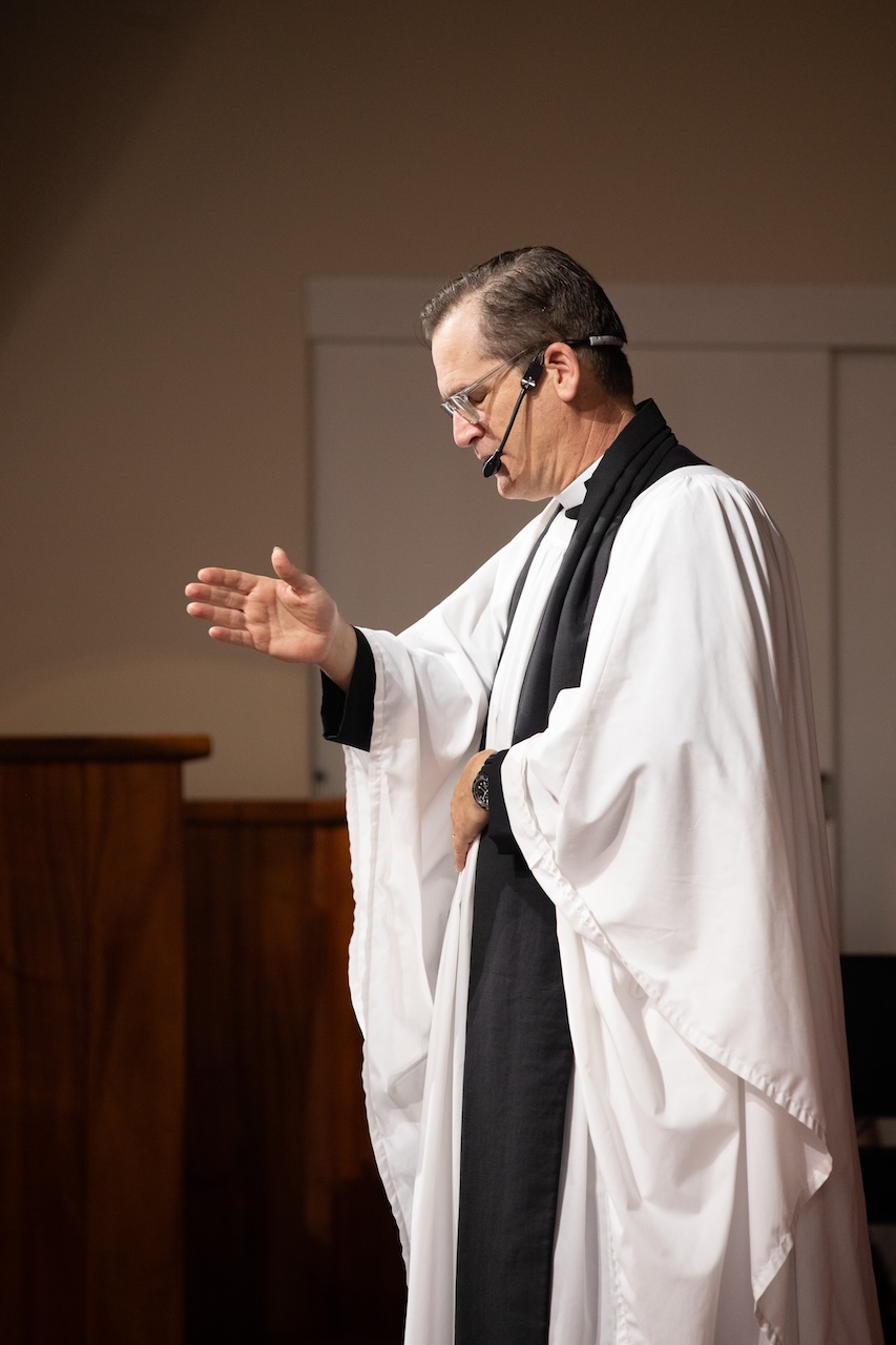 Chaplain Morehouse, a staple figure in ‘Iolani’s spiritual life, is pictured giving his final remarks of the day to the juniors and seniors during their weekly chapel service. At the end of every service, Chaplain Morehouse intones the Trinitarian formula, saying, “In the name of the Father, Son, and the Holy Spirit, amen.”