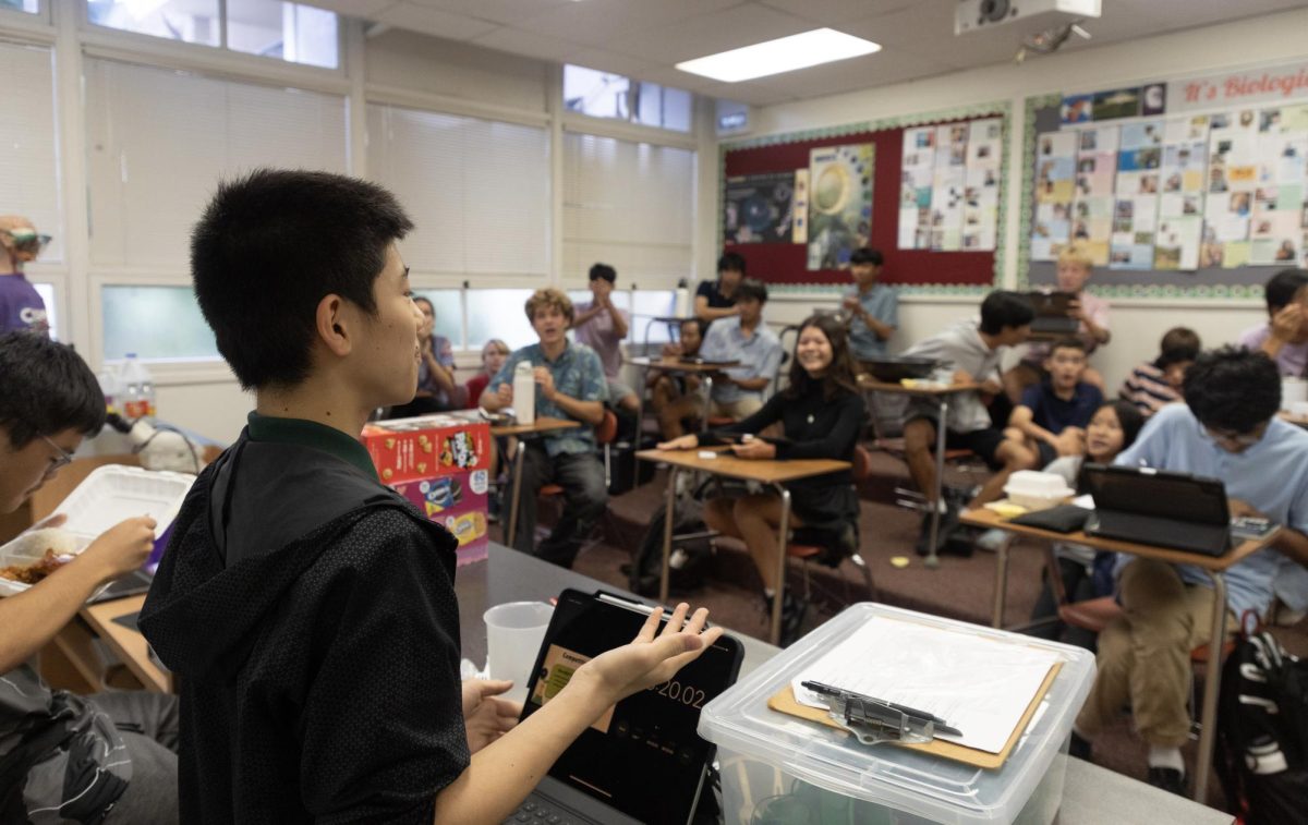 Biology Club’s inaugural meeting, led by Naoto H. ’28, students playing a natural selection game involving members using different utensils to fish for chocolate crackers.
