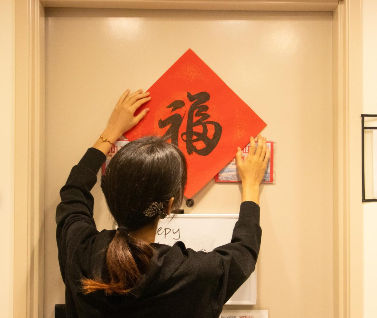 As a longstanding Chinese tradition, Sophia D. ‘27 places 福, the character meaning luck, on doors during New Years in hopes of having a healthy and prosperous year ahead. 

